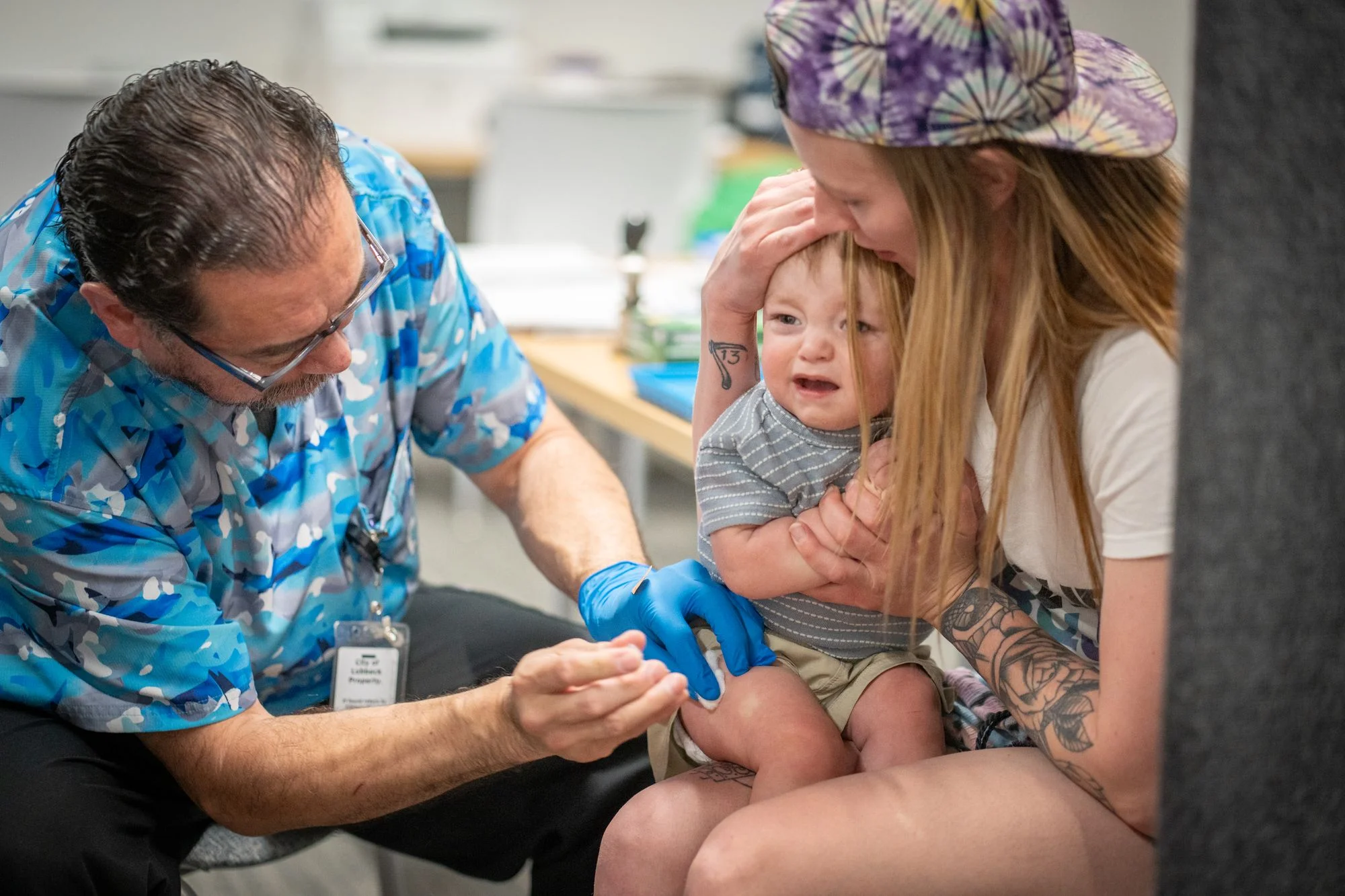 A one-year-old is receives an MMR vaccine