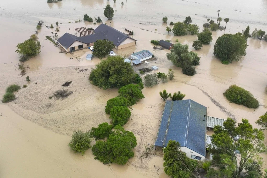 Homes are submerged in a flood caused by Cyclone Gabrielle in Awatoto, near the city of Napier in New Zealand, on February 14, 2023. Photo: AFP