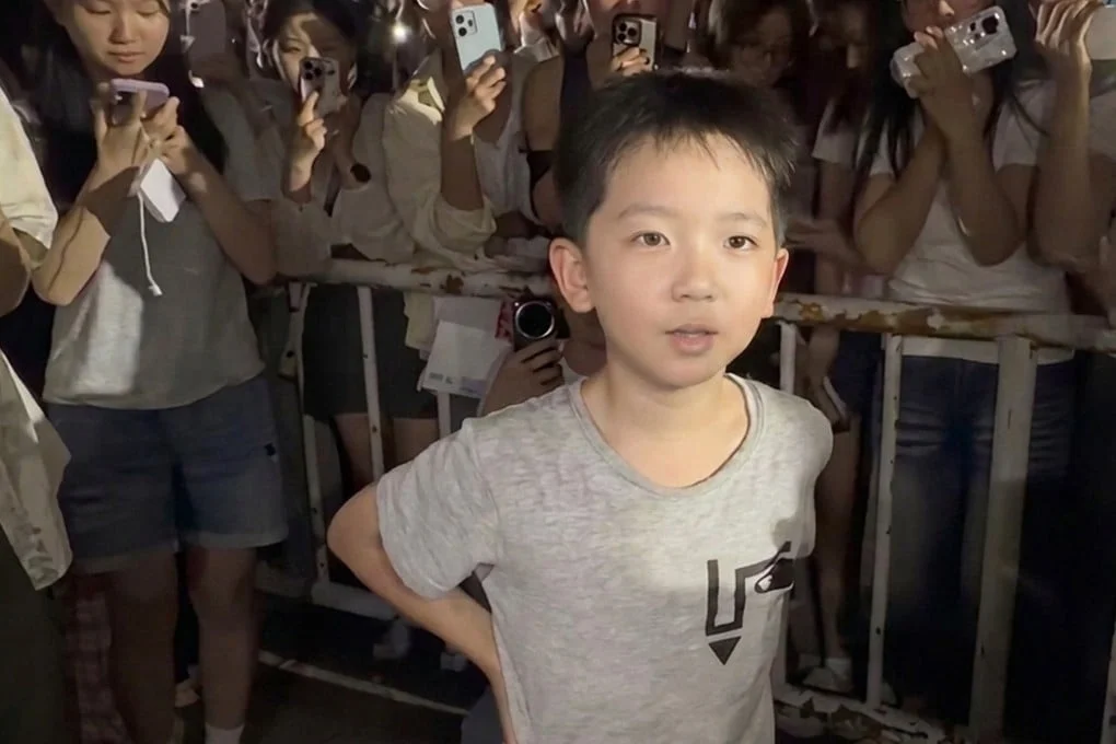 An eight-year-old Chinese boy touched hearts online after stepping up to promote his single mother’s small recycling business during a football match. Photo: Weibo