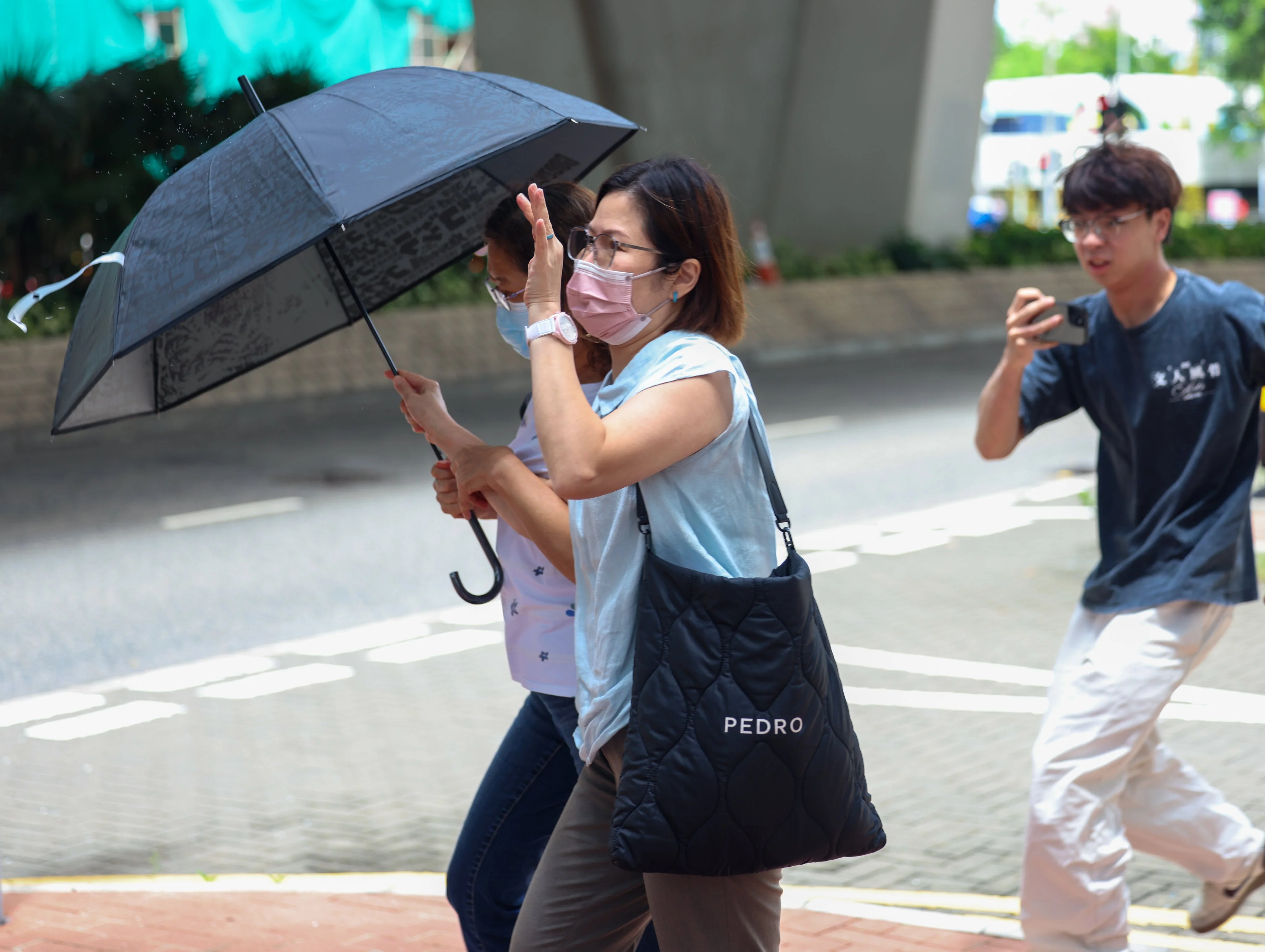 Former Prince of Wales Hospital nurse Cheung Mei-lin (in pink mask) leaves the Coroner’s Court on Friday. Photo: Brian Wong