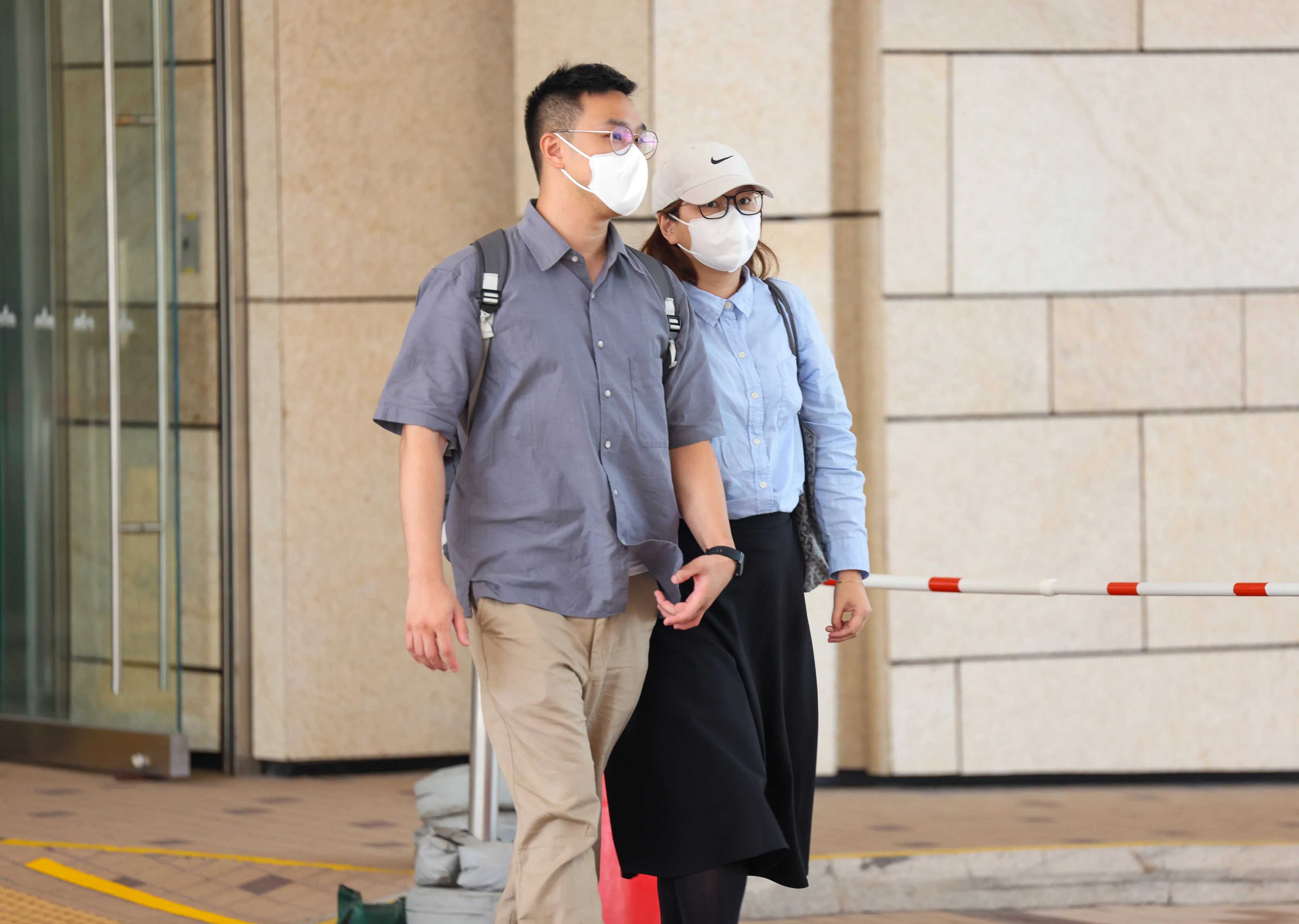 The baby’s parents, Yu Ping-hang (left) and Law Ka-sin, leave the Coroner’s Court on Friday. Photo: Brian Wong