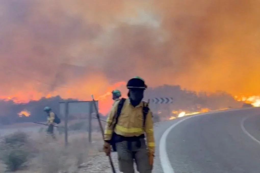 Emergency personnel work during a wildfire in Almeria, Spain, in this screengrab taken from a handout video released on Friday. Photo: Handout via Reuters