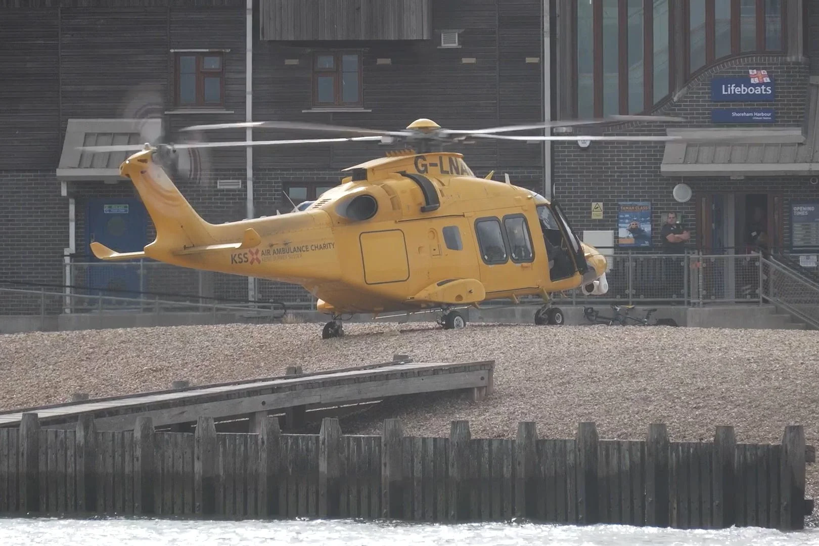 An air ambulance lands on the beach at Shoreham-by-Sea