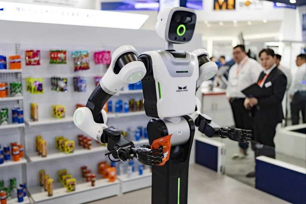 Visitors explore the Mech-Mind Robotics booth during Smart Factory & Automation World 2026 in Seoul, South Korea, on March 5. Photo: NurPhoto via Getty Images