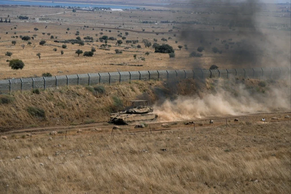 An Israeli tank drives along the ceasefire line between the Israeli-occupied Golan Heights and Syria on Thursday. Photo: Reuters