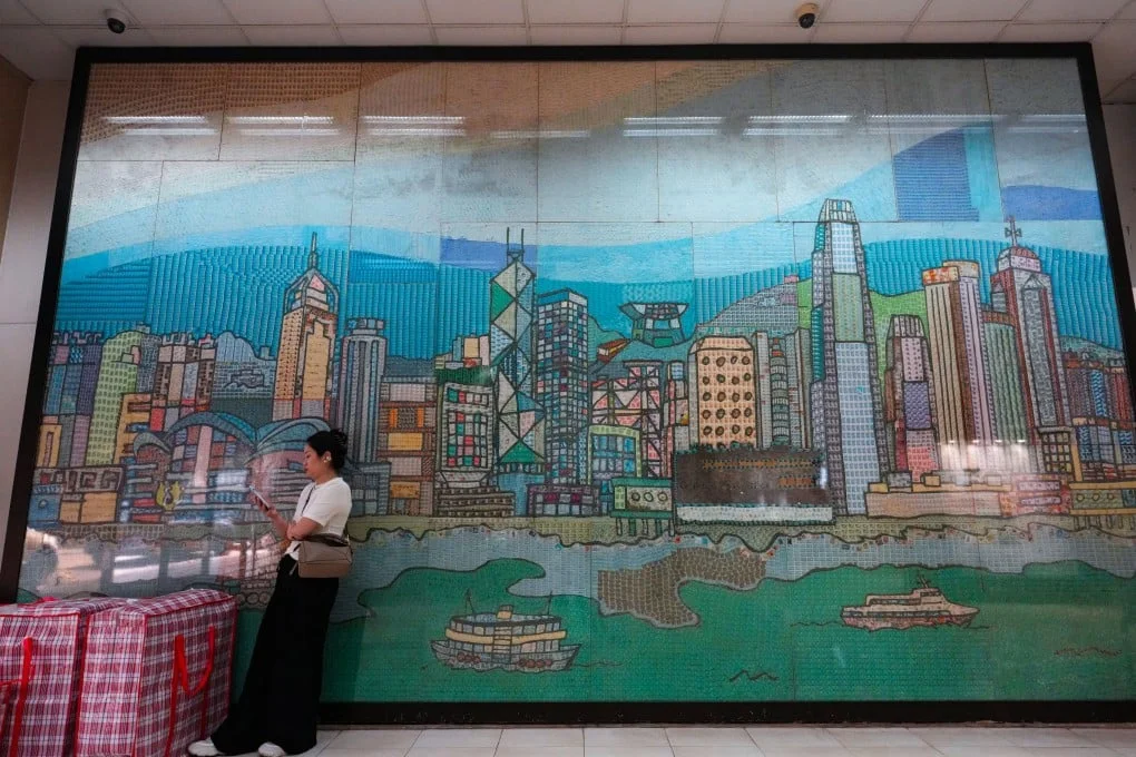 A woman waits at the General Post Office in Central, Hong Kong. Hongkong Post has recorded a loss for eight consecutive years. Photo: Jelly Tse