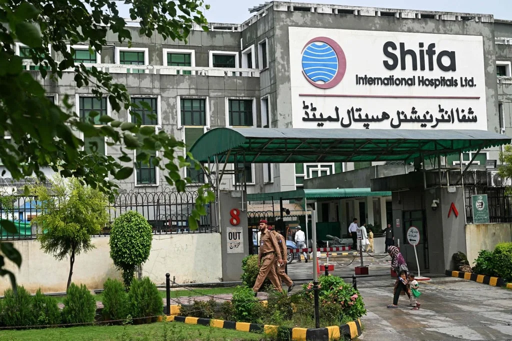 Police walk past Shifa International Hospital following Khan’s medical examination in Islamabad, Pakistan on Friday. Photo: AFP