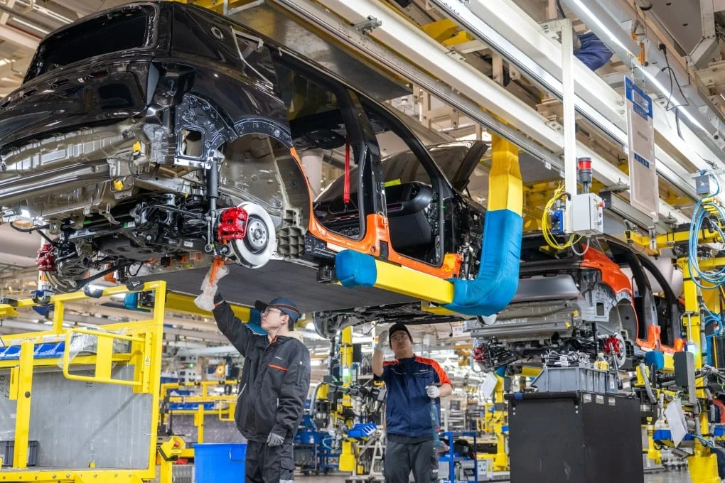Technicians work at a Geely Auto plant in Zhejiang province. Photo: Getty Images