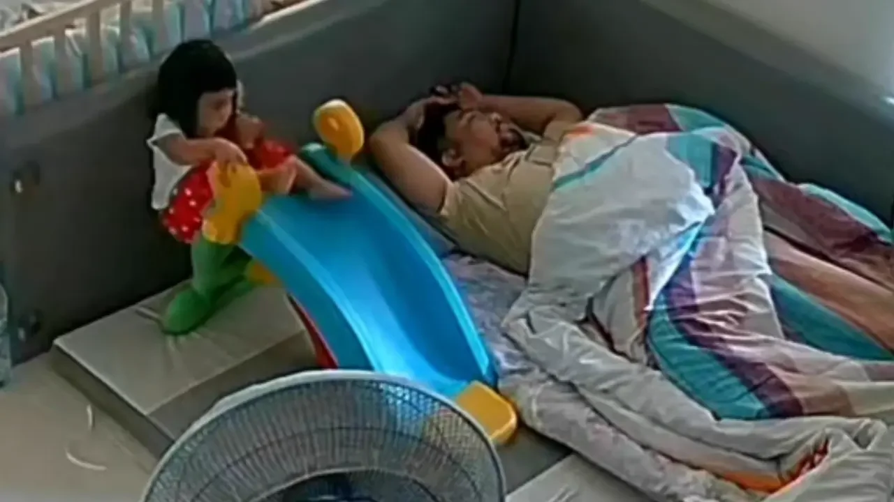 Toddler's safe landing after slip on slide in Bangkok