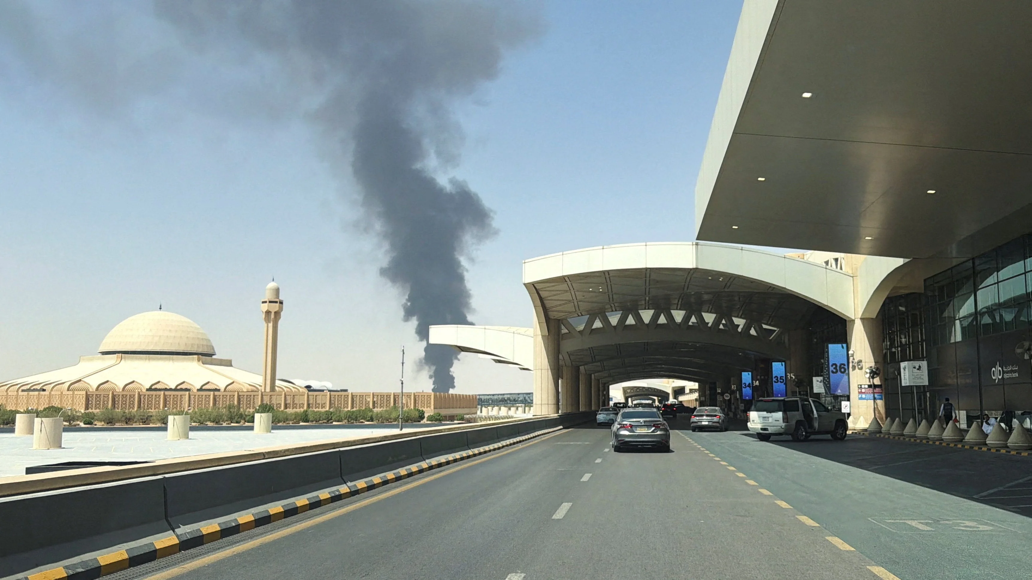A large plume of black smoke rises from the fuel storage depot at King Khalid International Airport in Riyadh, Saudi Arabia, on September 19. Photo: Reuters