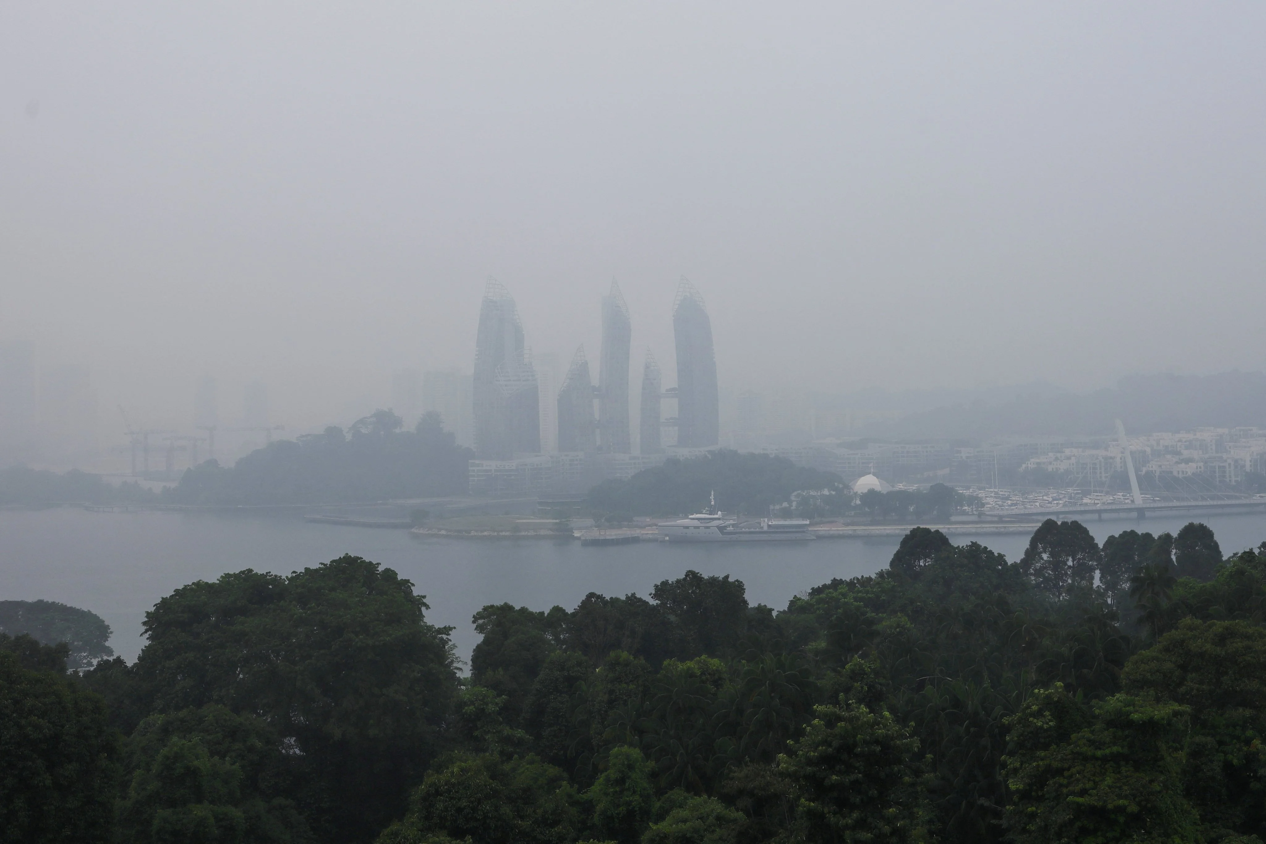 Haze shrouds a luxury condominium at Keppel Bay in Singapore on Wednesday. Photo: Reuters