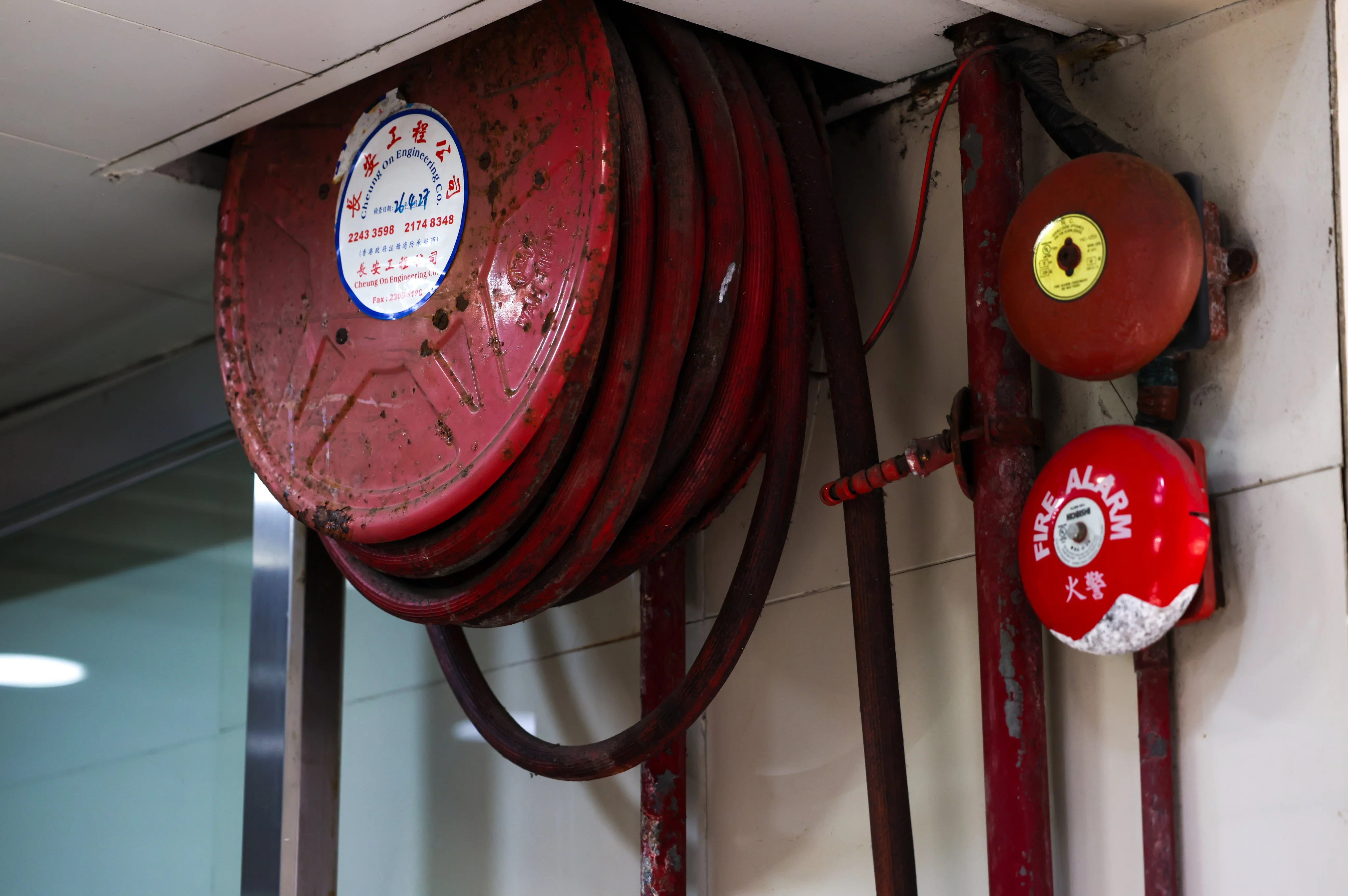 Traditional fire safety equipment includes fire alarms, hosepipe reels and sprinkler pipes. Photo: Silvia Siu