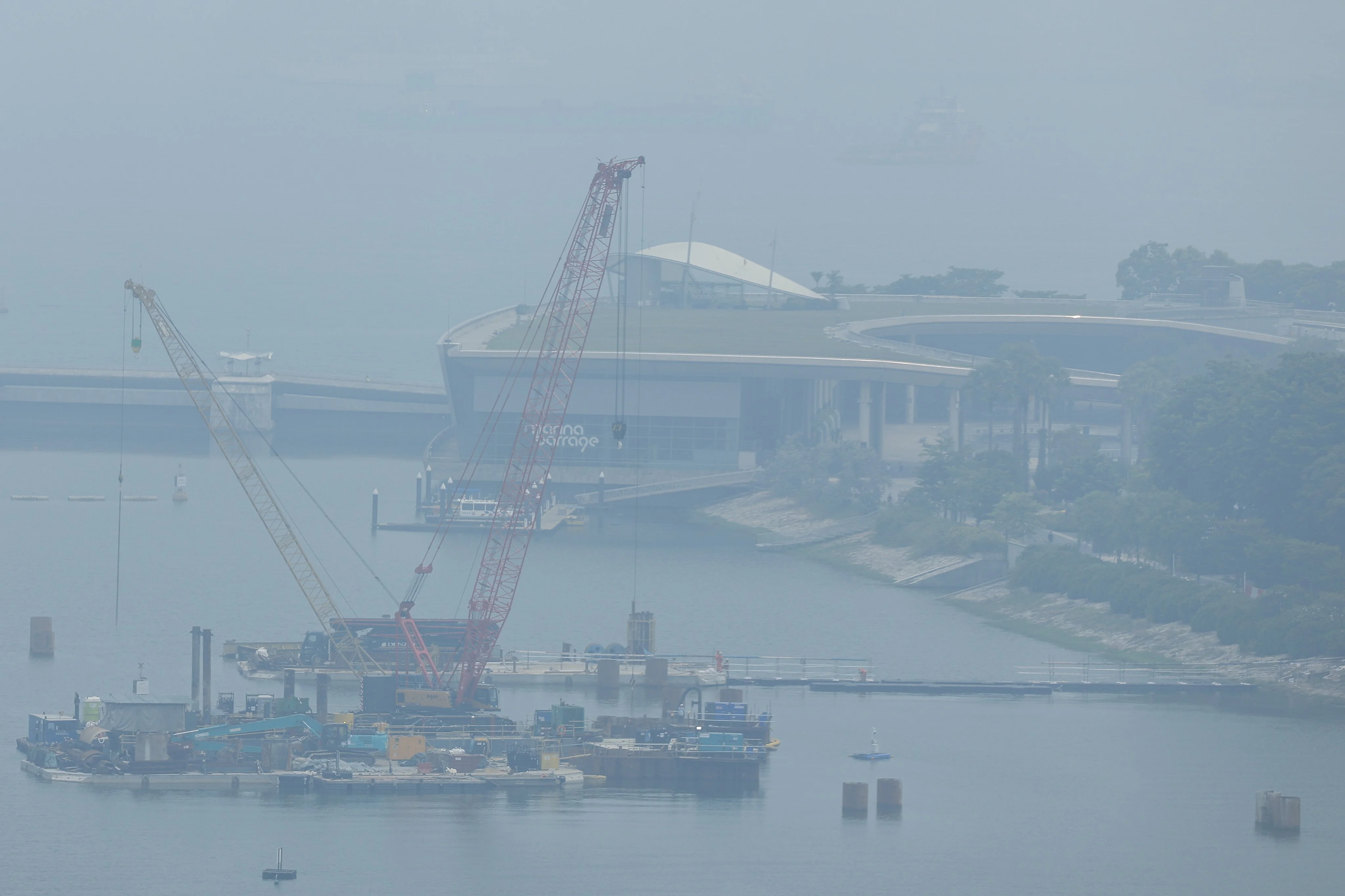 A thick haze shrouds the Marina Barrage area ahead of the 2026 Formula One Singapore Grand Prix in Singapore on Saturday. Photo: EPA