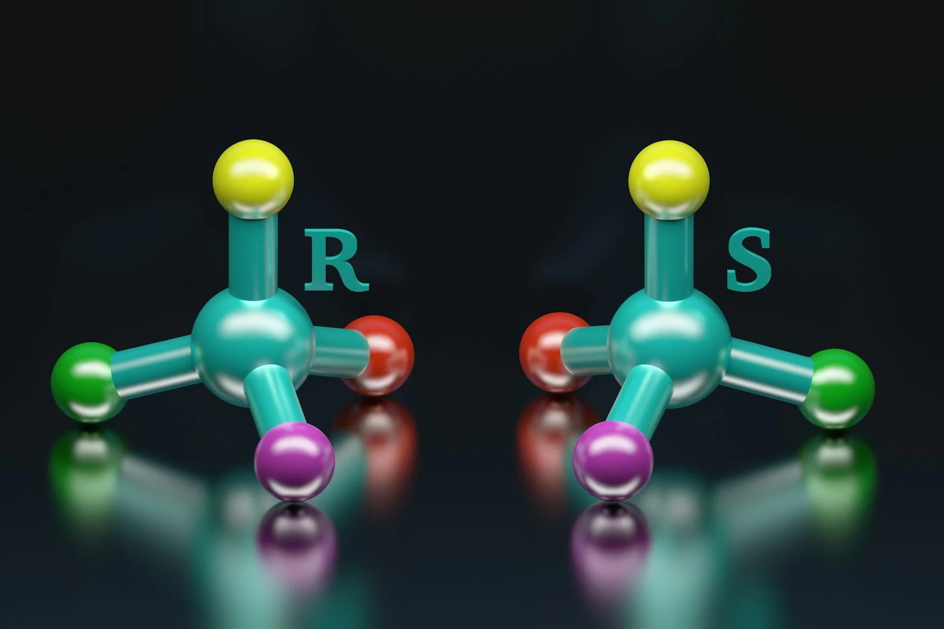 A diagram showing two molecules, made of of the same four atoms, but in mirrored forms so that one is 'left-handed' and one is 'right-handed'
